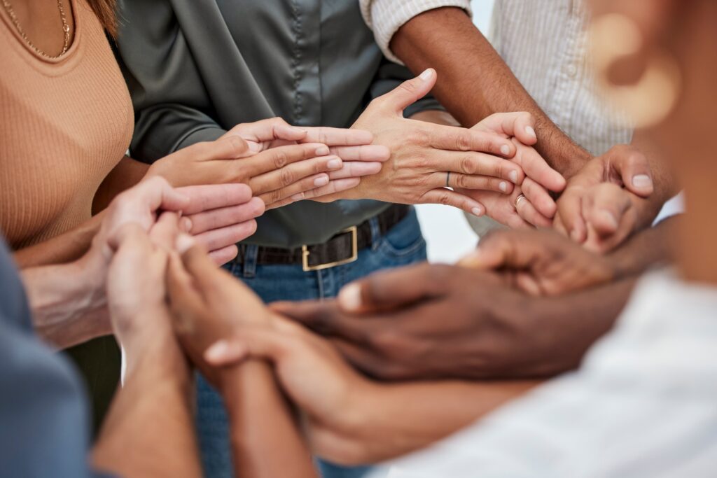 Community, partnership and support from hands of business people for teamwork, collaboration and tr